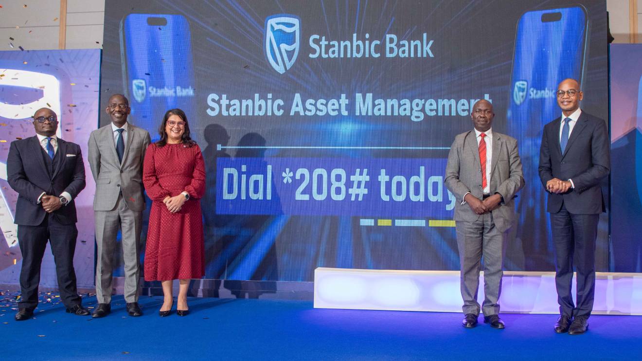 Stanbic Bank Executives and Wyckliffe Shamiah, CEO Capital Markets Authority pose of a photo during the launch of the Stanbic Money Market Fund (KES) and the Stanbic Fixed Income Fund (USD). PHOTO/COURTESY